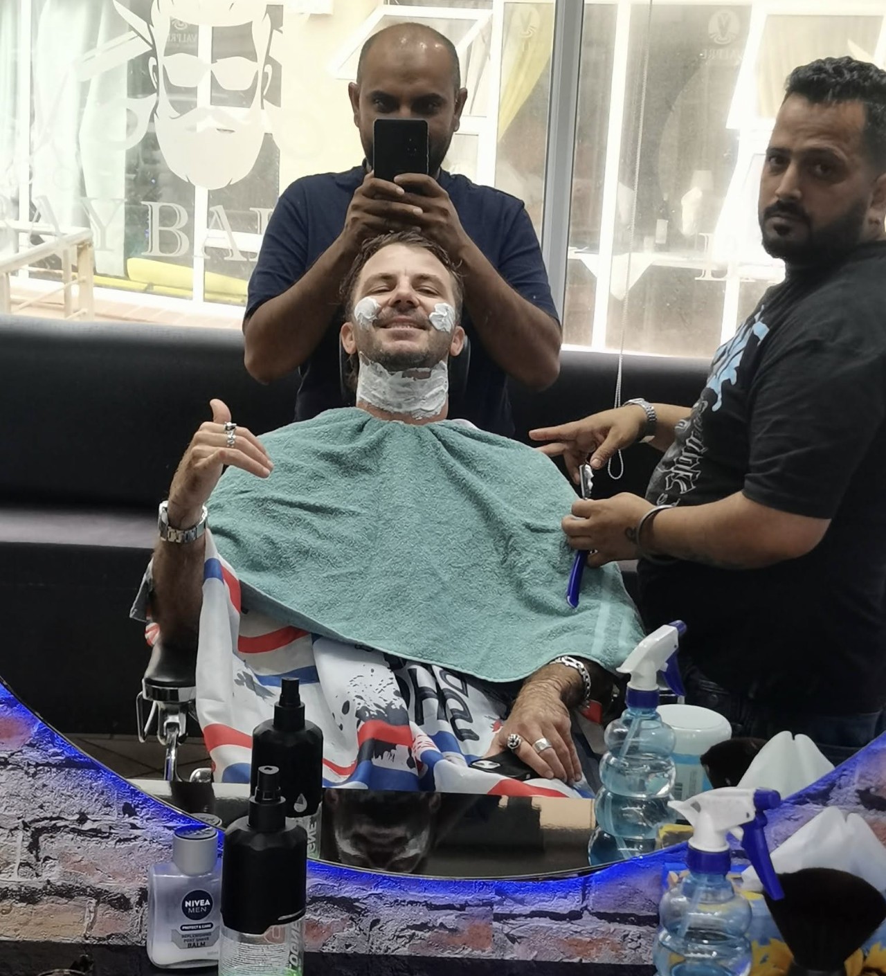 Classic straight-razor shave in progress at Bay Barber, Port St Francis